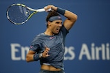 Nadal hits forehand in win over Dutra Silva