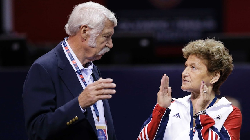Bela Karolyi (L) and his wife Martha Karolyi talk before 2012 US women's gymnastics Olympic trials.