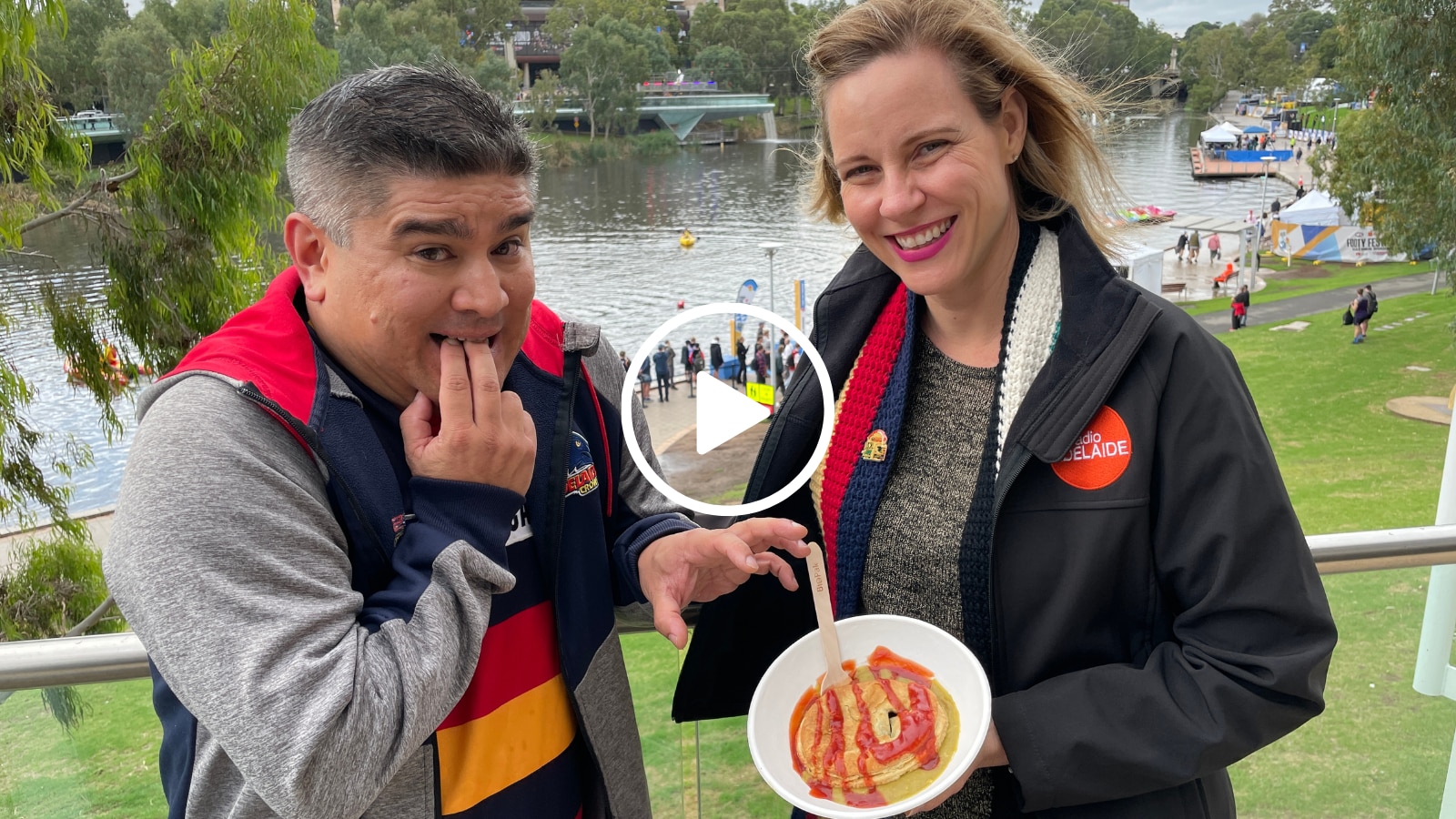 a man and a woman hold a pie in their hands