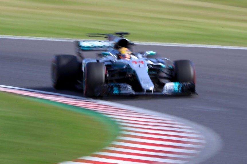 Lewis Hamilton races at Japanese Grand Prix