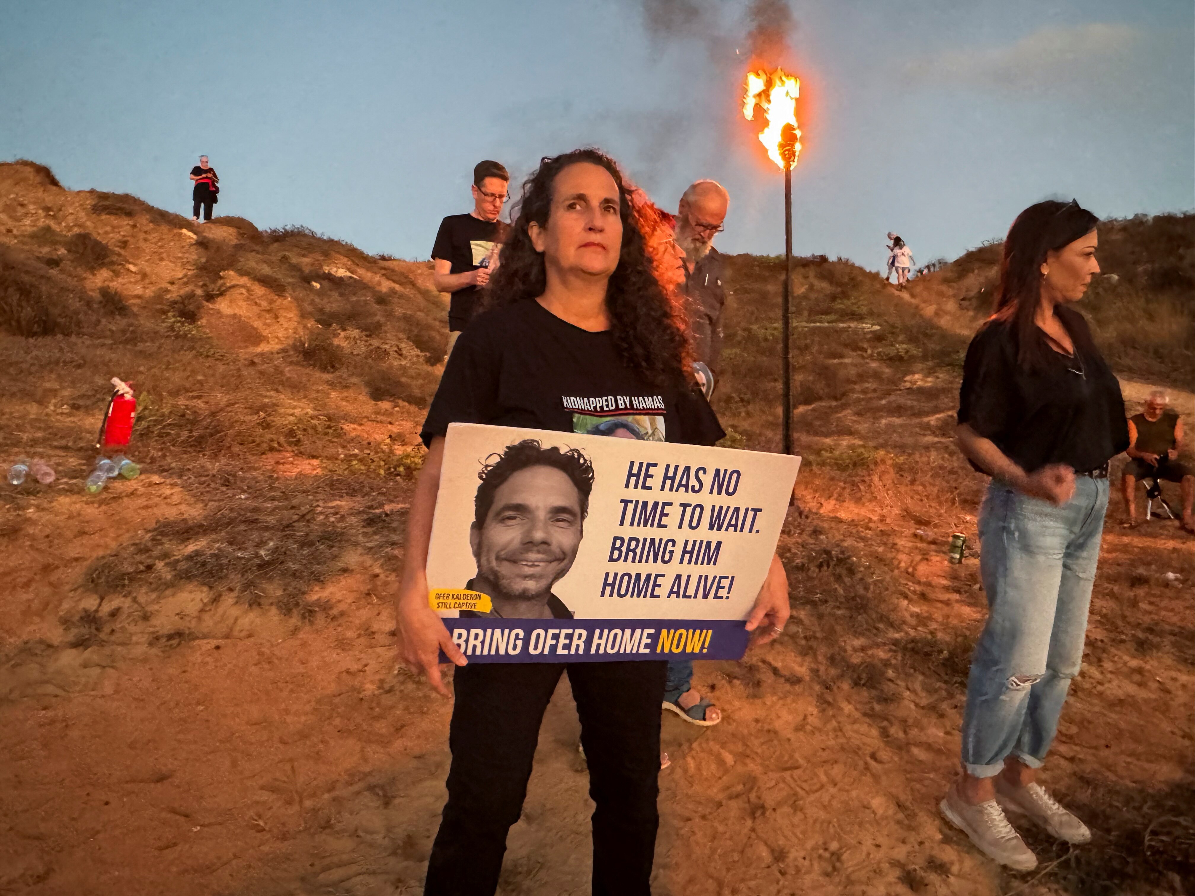Hadas Kalderon holding a protest sign