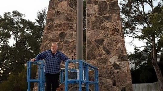 Stanthorpe Chamber of Commerce vice president Mick Spiller at the Big Thermometer showing -4.1 temperature.