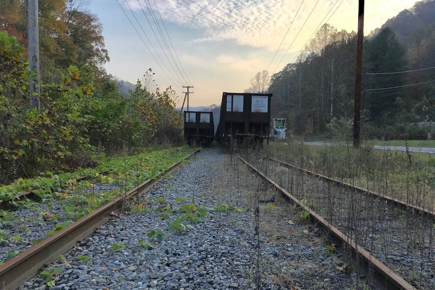 Old rail lines and freight train cars in Logan County in West Virginia.