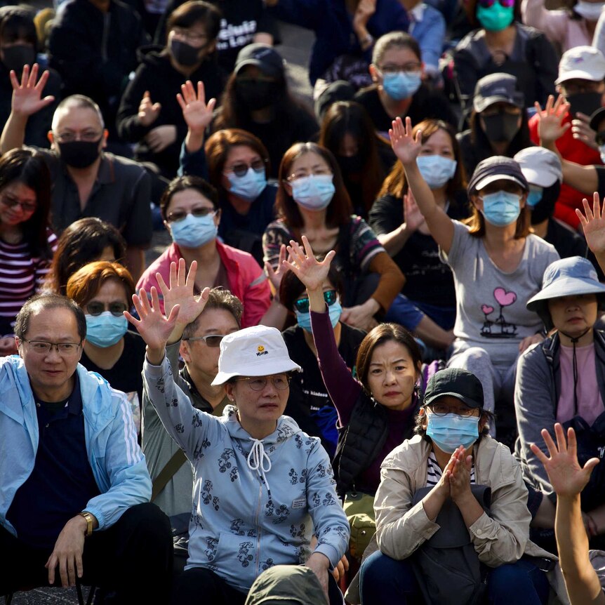 "Silver haired" protesters raise their hand to symbolise the five demands of the democracy movement.