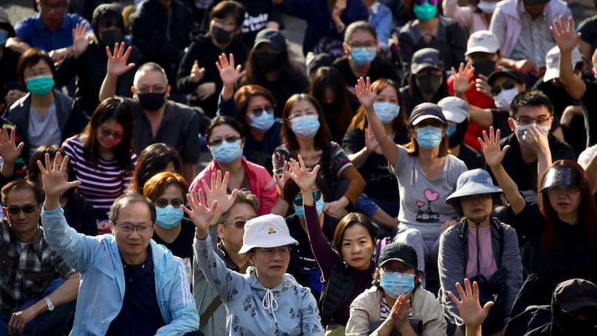 "Silver haired" protesters raise their hand to symbolise the five demands of the democracy movement.