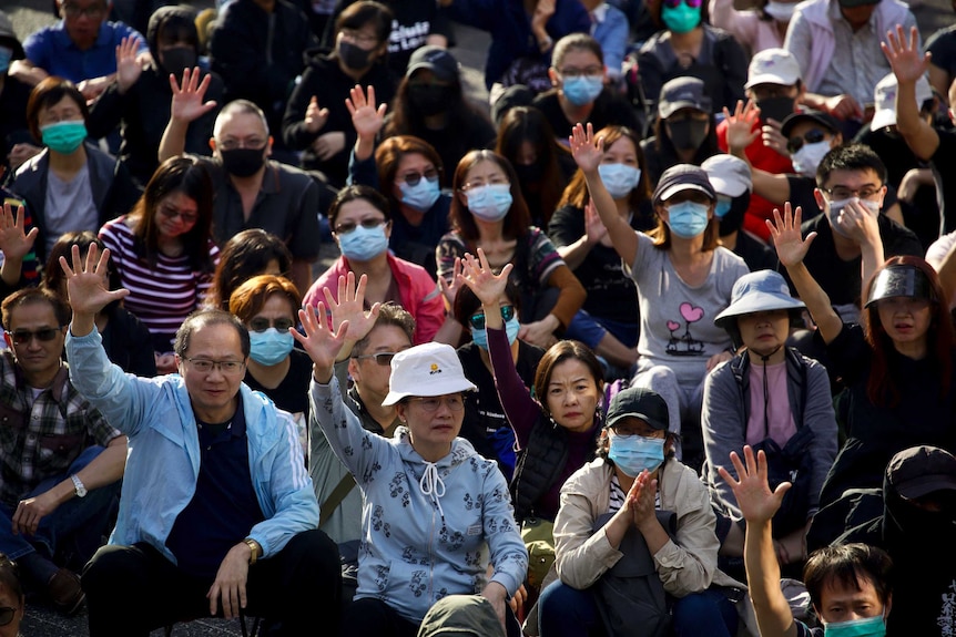 "Silver haired" protesters raise their hand to symbolise the five demands of the democracy movement.