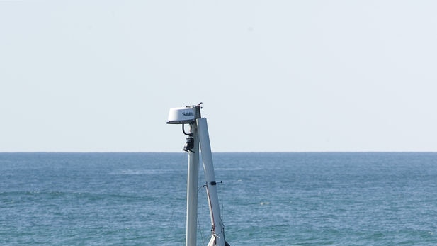 Jessica Watson guides boat through seaway