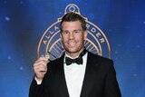 David Warner poses for a photograph with the Allan Border Medal after his win on January 23, 2017.
