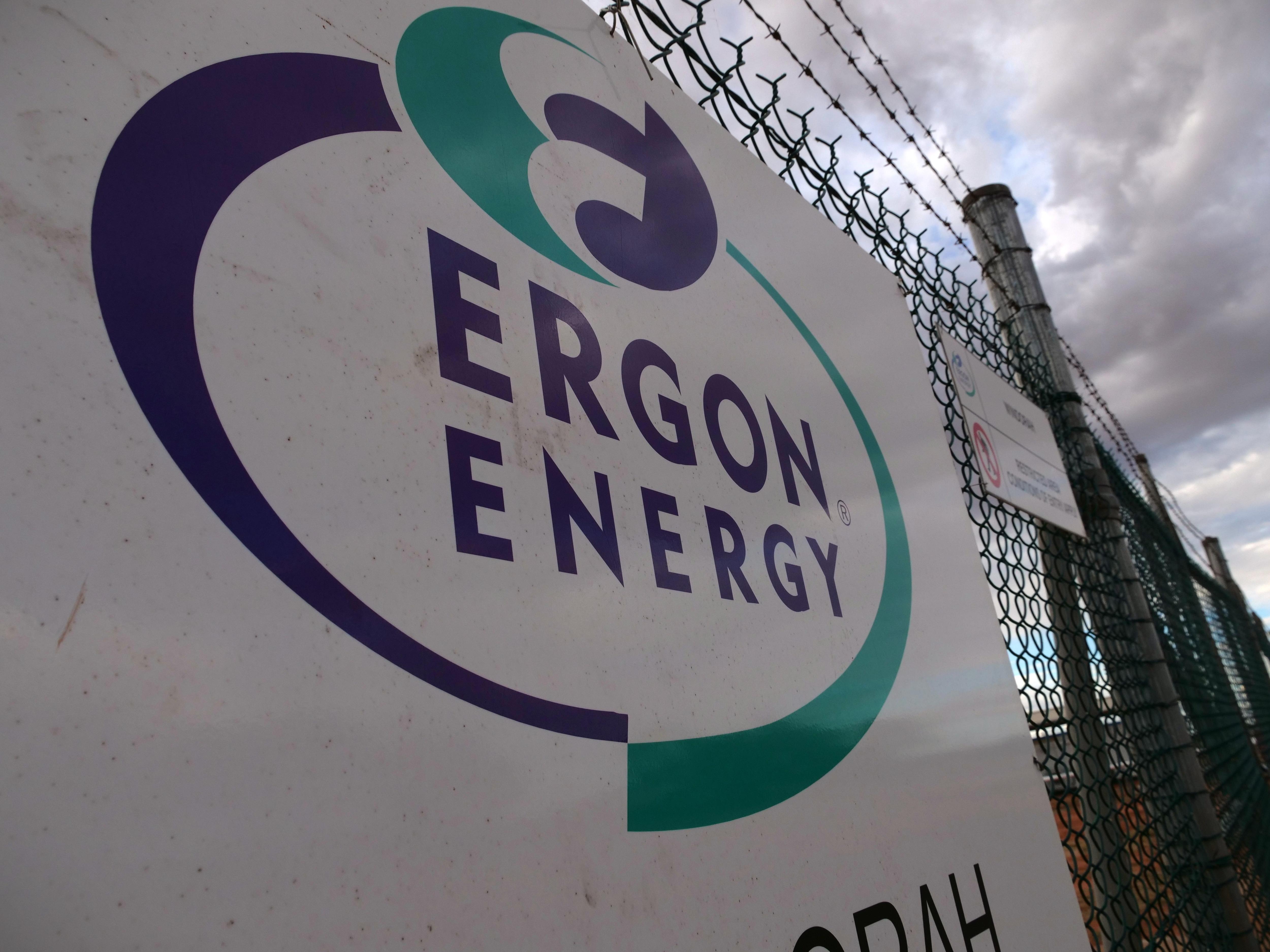 Sign with Ergon logo hanging on fence.