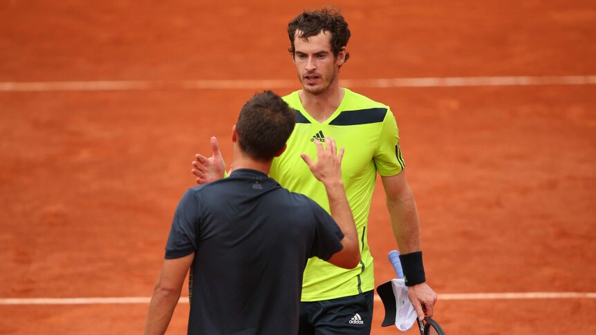 Andy Murray shakes hands with Philipp Kohlschreiber after their 2014 third round French Open match.