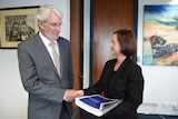 Retired Justice Alan Wilson hands over report into Queensland's VLAD laws to Queensland Attorney-General Yvette D'Ath