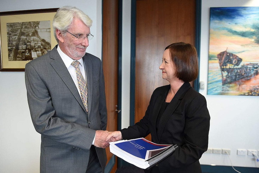 Retired Justice Alan Wilson hands over report into Queensland's VLAD laws to Queensland Attorney-General Yvette D'Ath
