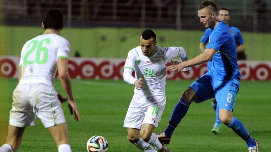 Algeria's Kadir Foued vies for the ball