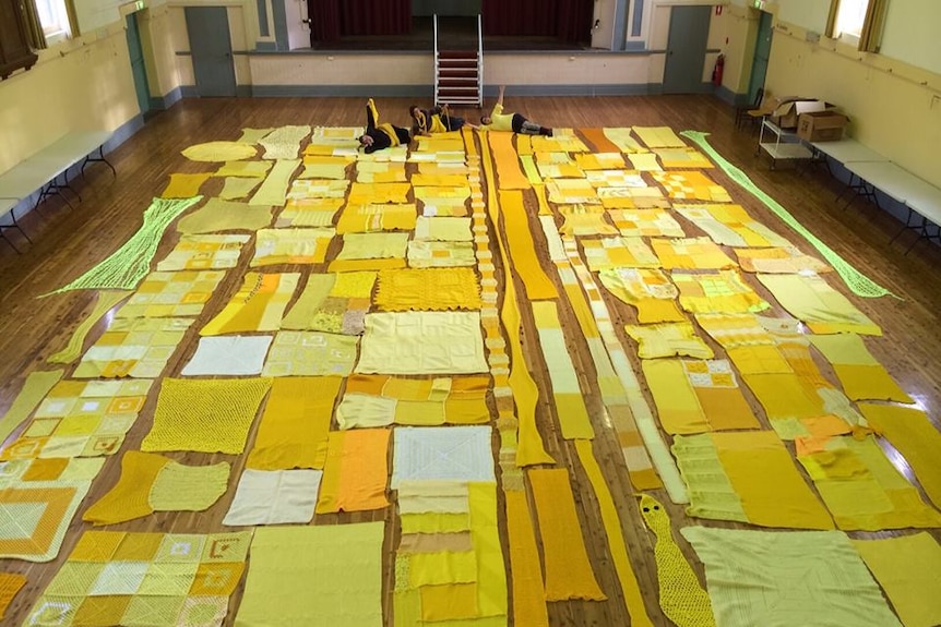 Knitters in Holbrook with yellow wool