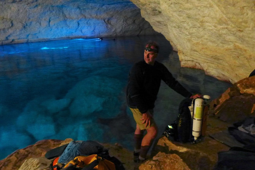 Joseph Bicanic stands near an underwater cave