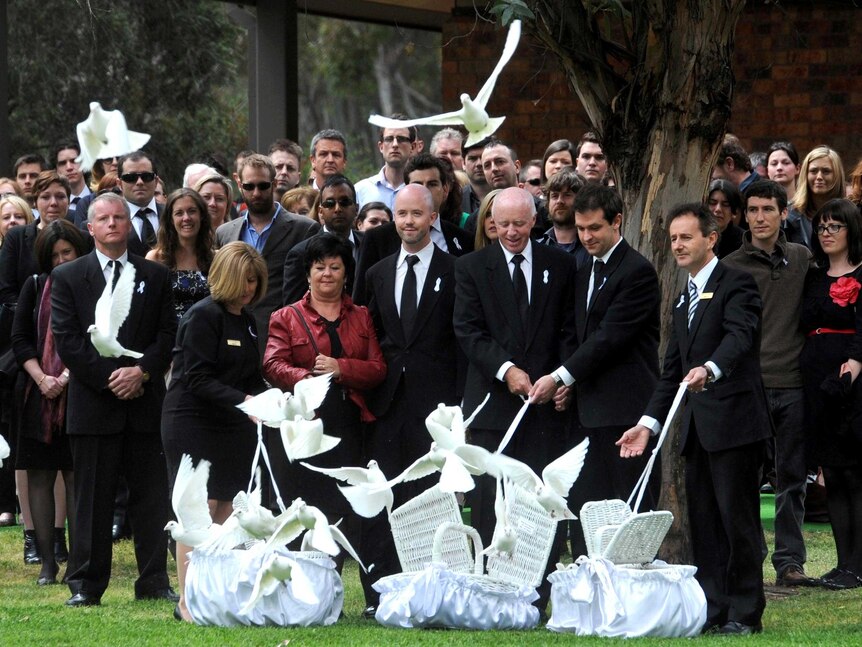 The family of Jill Meagher release white doves at the conclusion of her funeral.