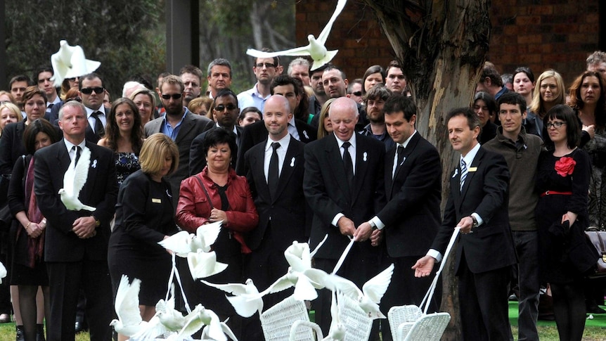 The family of Jill Meagher release white doves at the conclusion of her funeral.