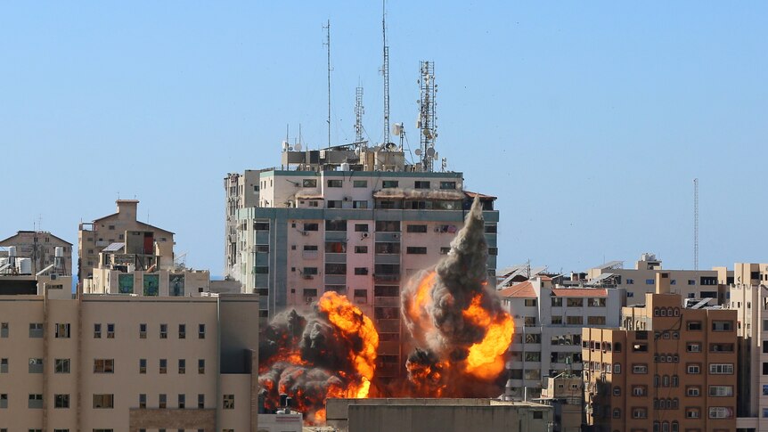 Israeli forces destroy media outlets' Gaza base, as Hamas continues stream of rocket volleys