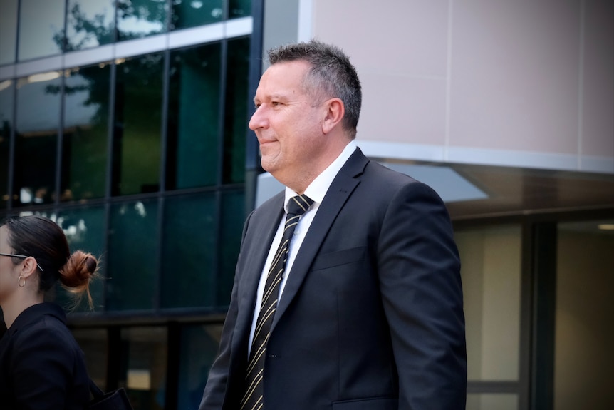 A man in a suit walking out of Parramatta court