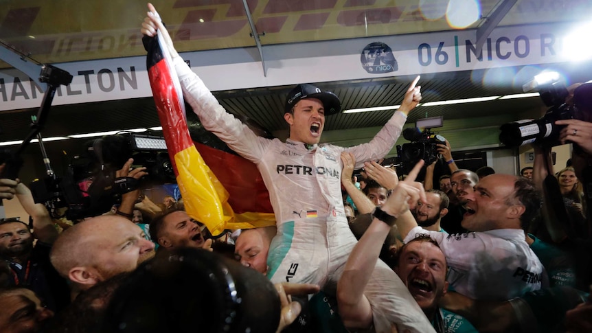 Mercedes driver Nico Rosberg celebrates winning 2016 F1 world title after the Abu Dhabi Grand Prix.
