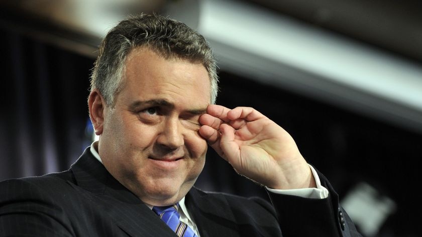 Joe Hockey laughed off criticism for not announcing details of the savings during his speech.