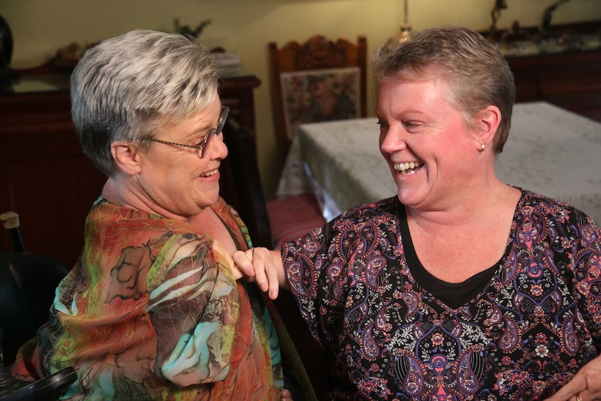 Mary Henley-Collopy and Lisa McManus smiling and laughing together