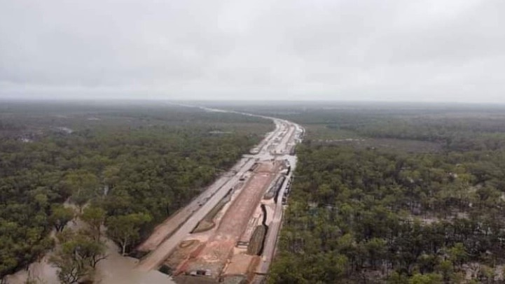 A bird's-eye-view of a rail line inundated by water.