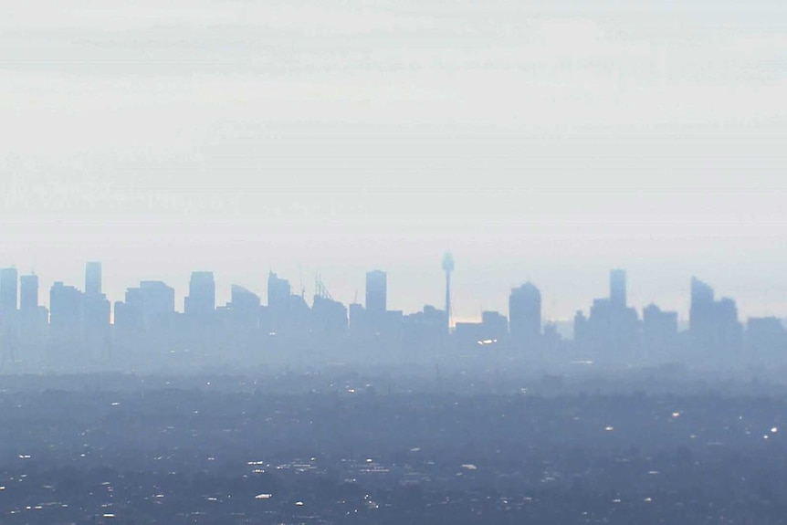 Silhouette of Sydney CBD covered in smoke haze on September 11, 2023