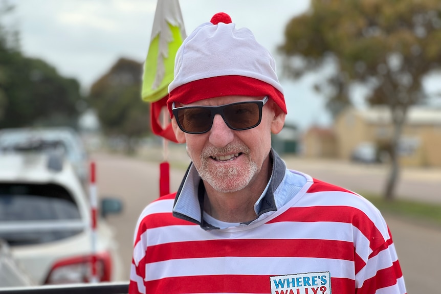 A man dressed in red and white.