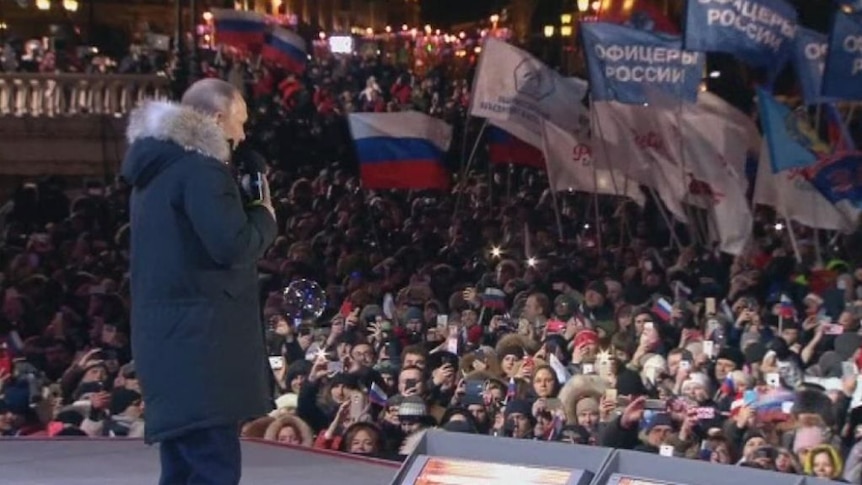 Vladimir Putin celebrates election victory at a rally in Moscow