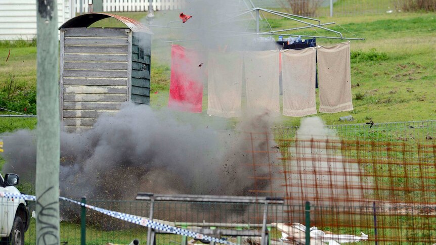 Police detonate household chemicals in the backyard of Dell's Ipswich home in 2013.