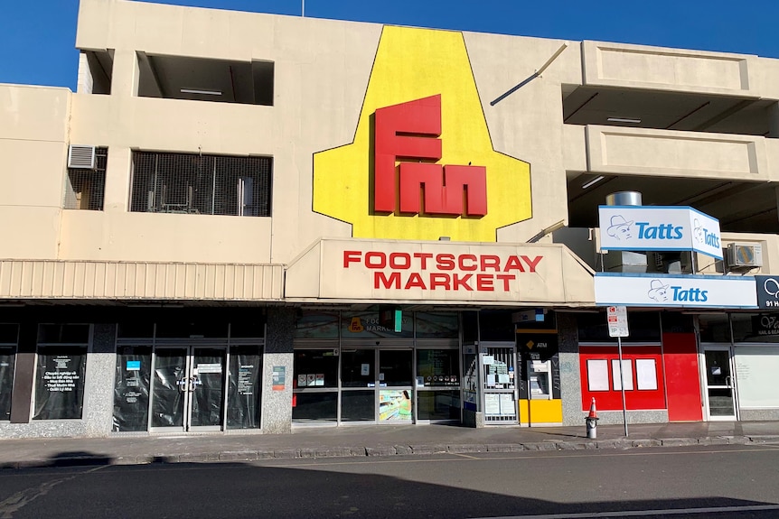 The entrance to the Footscray Market with a large red and yellow sign.  