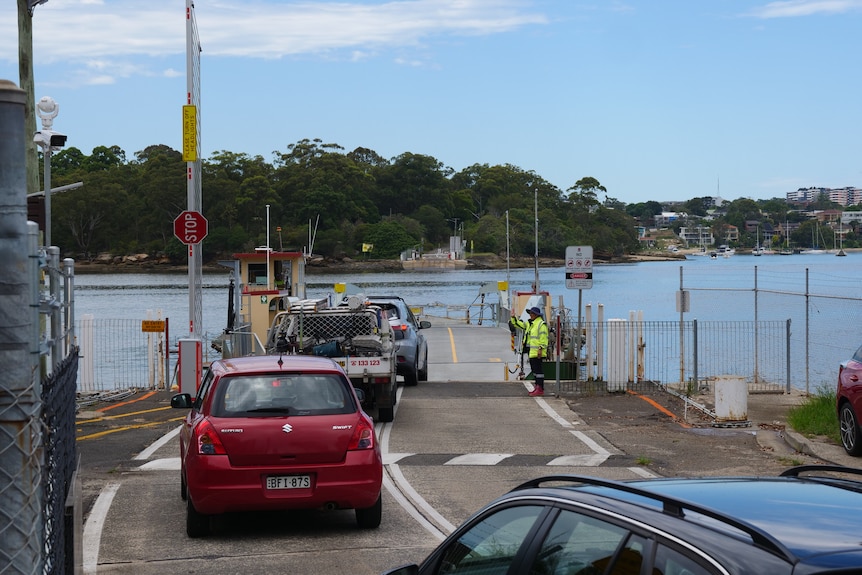 A floating ferry allows cars to drive on board