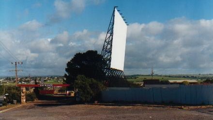 A large cinema drive-in screen from the side.