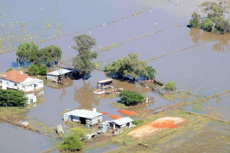 Water swamps a property in Merah North, as floods sweep across northern NSW