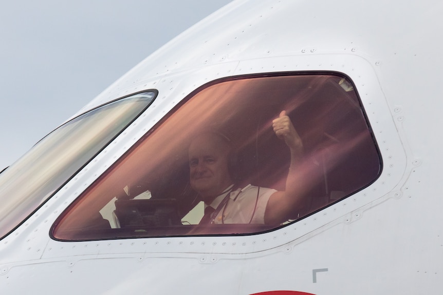 A Qantas pilot gives the thumbs-up after landing in Sydney in November,