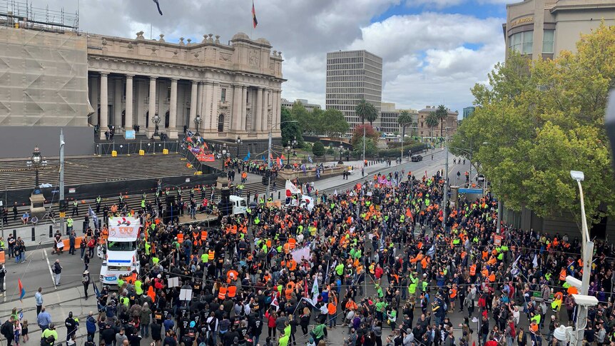 Thousands of people arrive at the steps of Victoria's Parliament House.