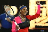 Serena Williams smiles as she raises her left arm after beating Simona Halep at the Australian Open.