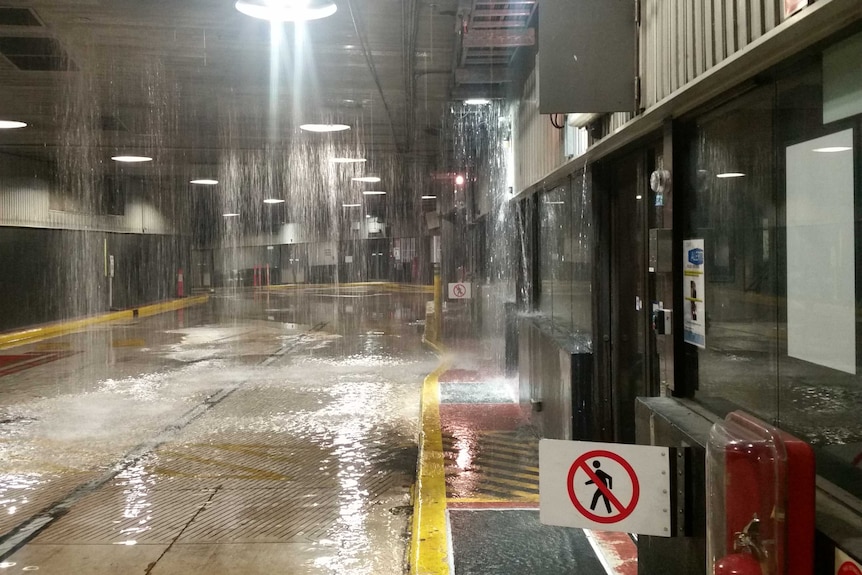 A burst water main causes flooding at the Queen Street bus station