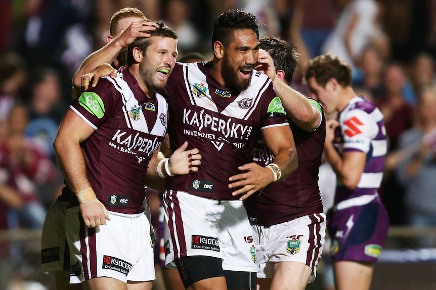 Manly celebrates a Blake Leary try against Melbourne