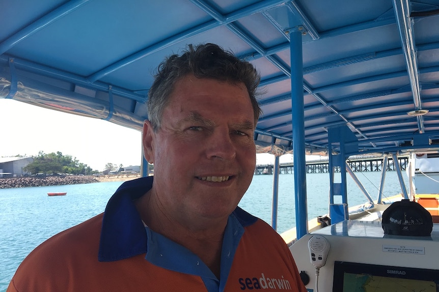 Tour operator Jim Smith in a boat off Darwin.