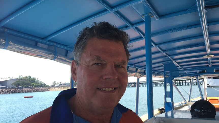 Tour operator Jim Smith in a boat off Darwin.
