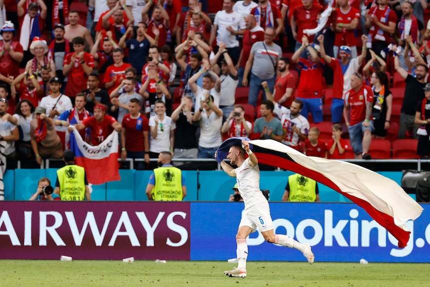 Czech Republic's Vladimir Coufal celebrates with national flag