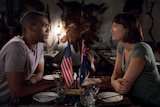 Actors in Netflix series Pine Gap smiling at each other.