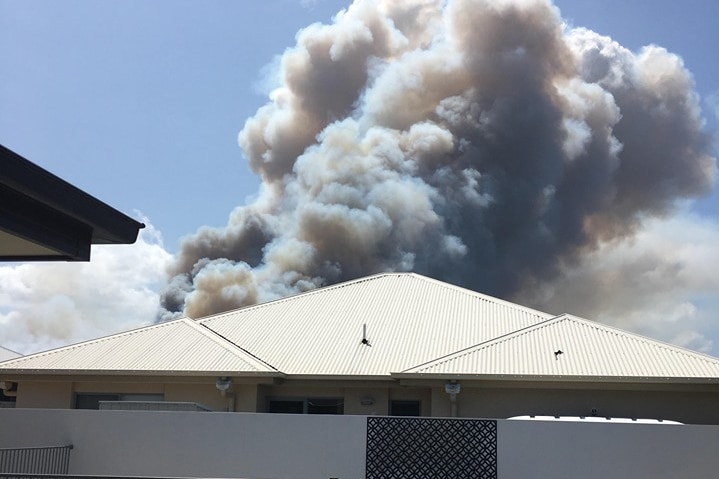 A big plume of smoke seen towering above a house in Peregian Springs.