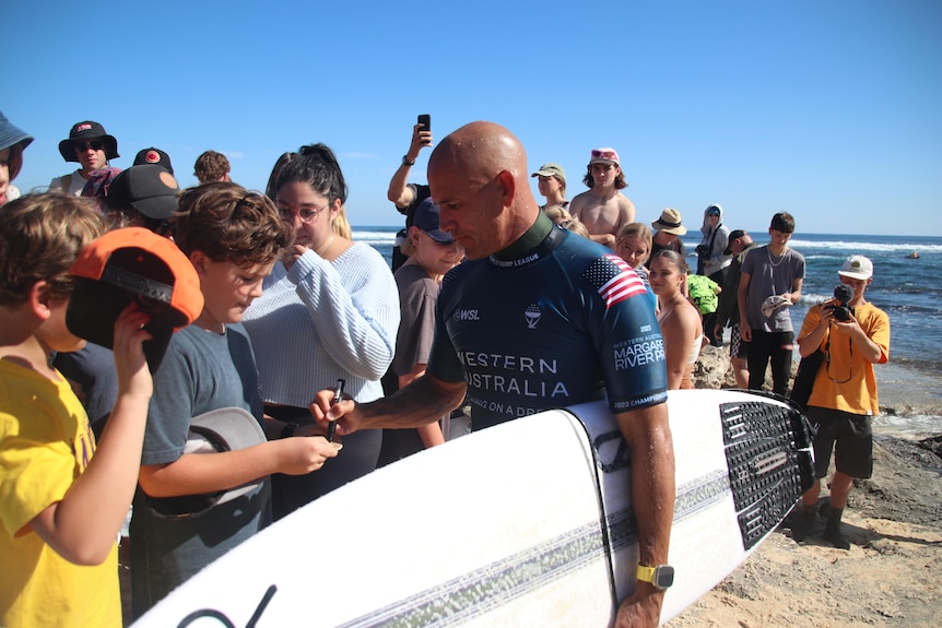 Kelly Slater signs autographs for fans at the Margaret River Pro.