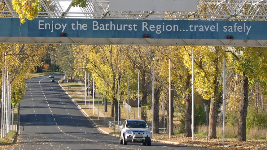 Car driving under the welcome sign for the regional city of Bathurst in central west NSW. Good generic April 2012.