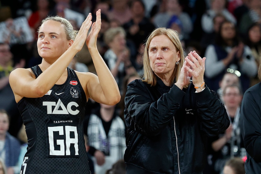 Kelly Singleton and Nicole Richardson clap their hands with tears in their eyes