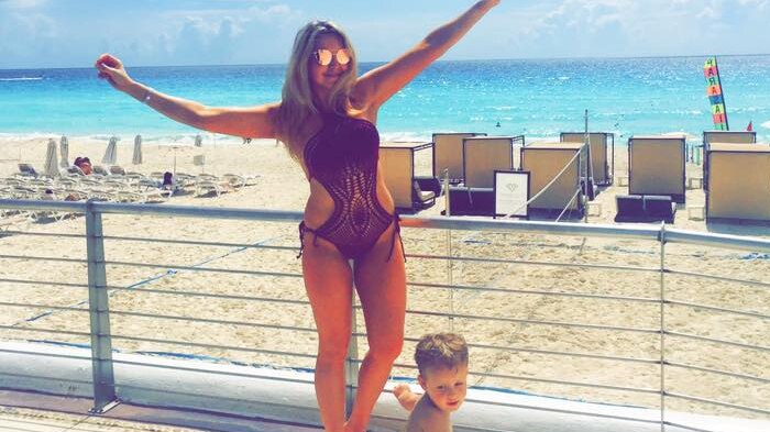 Eryn Ford with her son at the beach