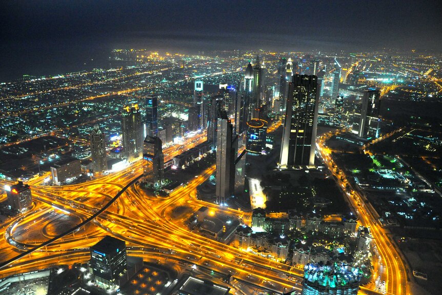 Dubai at night - illuminated high rises and street lights